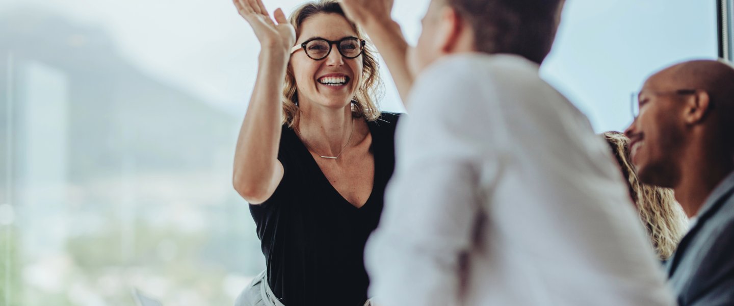 high five with colleagues